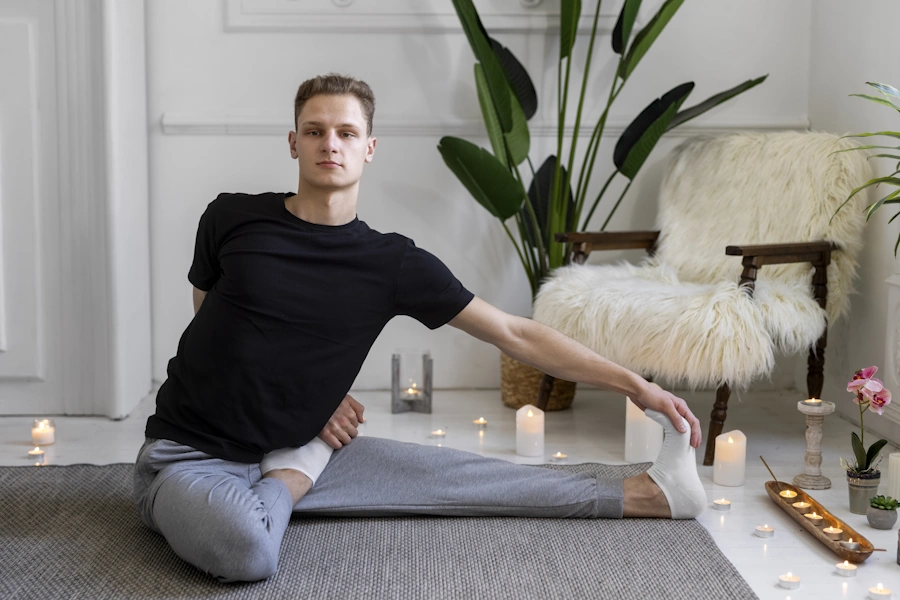 full-shot-man-doing-yoga-mat